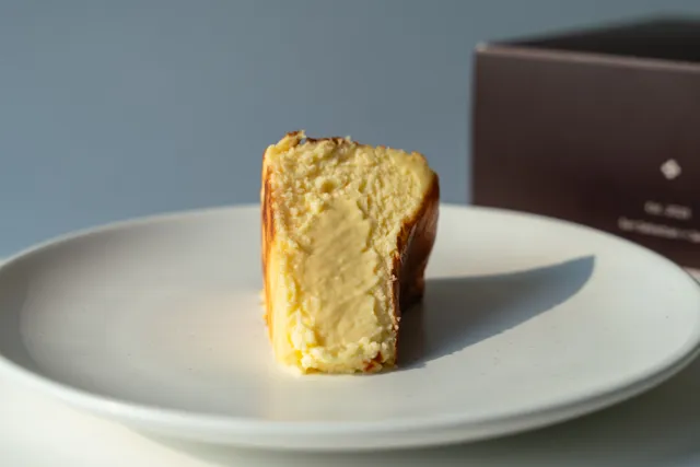 Composición de producto con tarta de queso